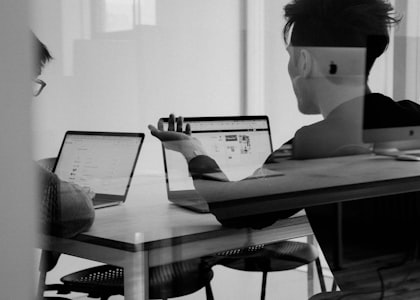 Clinical research coordinator reviewing study data at a site workstation