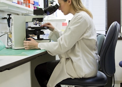 Laboratory researcher using a microscope